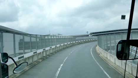 Shot-from-inside-the-tour-bus-along-the-street---high-way-of-Japan