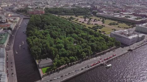 Saint-Petersburg,-an-aerial-drone-fly-to-footage-of-central-park-Summer-Garden,-boats-in-a-river,-channel,-Church-of-Savior-on-Blood,-Castle,-center-of-Saint-Petersburg