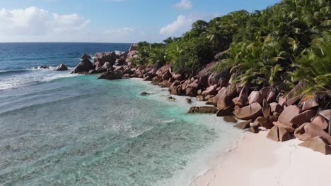 Aerial-view-of-the-white-beaches-and-turquoise-waters-at-Anse-Coco,-Petit-Anse-and-Grand-Anse-on-La-Digue,-an-island-of-the-Seychelles
