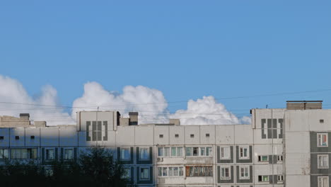 Time-lapse-of-a-cloud-over-a-standart-Russian-living-building-block