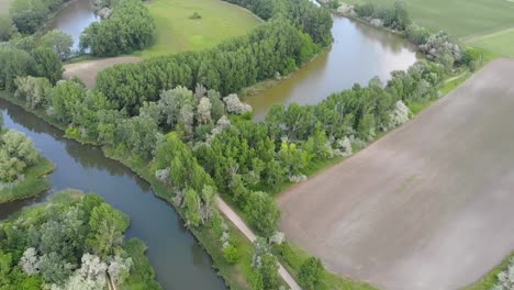 Pull-out-drone-shot-from-a-backwater-river-bend