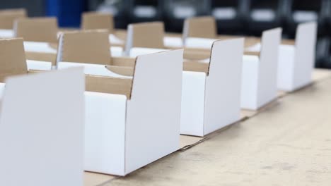 Rows-of-boxes-sit-in-a-warehouse