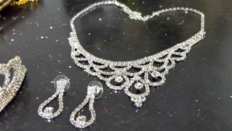 closeup-shot-of-woman-purse,-handbag,-necklace,-ear-ring-and-wedding-accessories