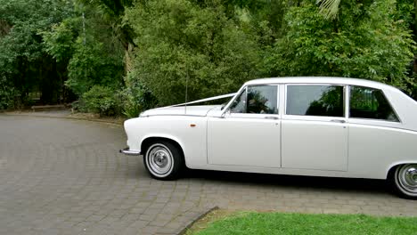 Shot-of-white-wedding-car-or-limo