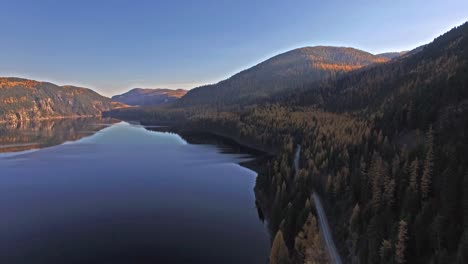 Aerial-Drone-Shot-in-Montana-on-a-lake-with-a-boat-in-the-Fall-or-Autumn