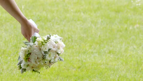 shot-of-bride---groom-with-wedding-flower