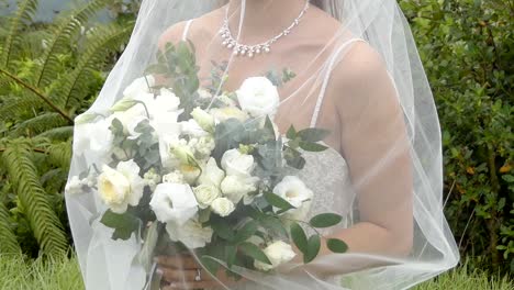 shot-of-bride---groom-with-wedding-flower