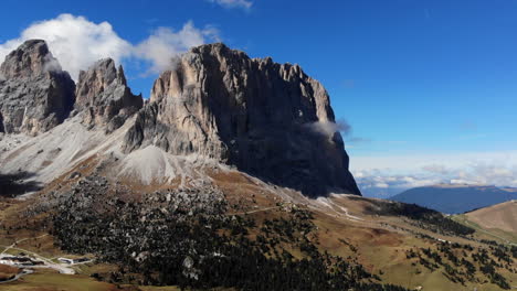 4K-drone-shot-flying-through-mountains-revealing-massive-dolomite-mountain-range-in-Italy