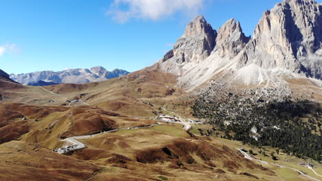 Drone-slowly-landing-in-mountainous-dolomite-valley-Italy