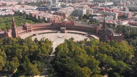 Pull-back-drone-shot-of-the-famous-Plaza-de-Espana-in-Seville,-Spain