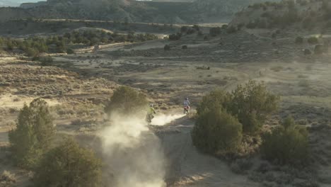 dirt-bike-riders-run-through-dusty-trail-in-colorado