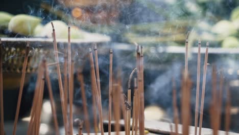 Close-up-of-incense-burning-outside-Asian-temple