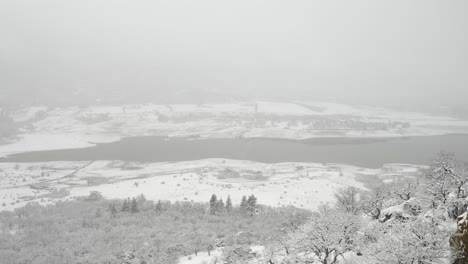 Drone-shot-of-snow-covered-Emigrant-Lake-near-Ashland,-Oregon