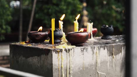 Candles-burning-outside-of-ancient-temple