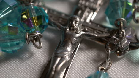 Close-up-of-a-Jesus-cross-and-beads