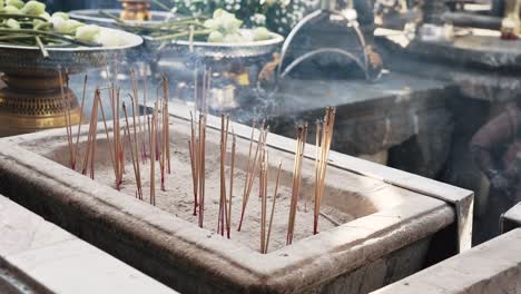 Wide-shot-of-incense-burning-outside-Asian-temple
