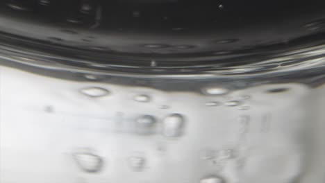 Macro-underwater-footage-of-bubbles-passing-by-submerged-Laowo-lens-with-lots-of-bubble-reflections-shot-with-Sony-F55-at-120fps