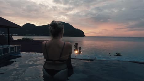 Girl-in-pool-overlooking-Koh-Pi-Pi-sunset