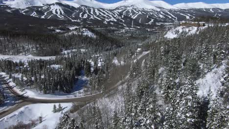 Pan-up-from-spruce-trees-to-reveal-Breckenridge-ski-resort