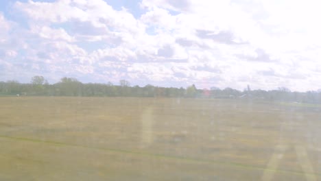 High-Speed-Train-Travel,-Countryside-View-from-Window