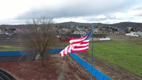 Aerial-view-of-American-flag-waving-in-the-wind