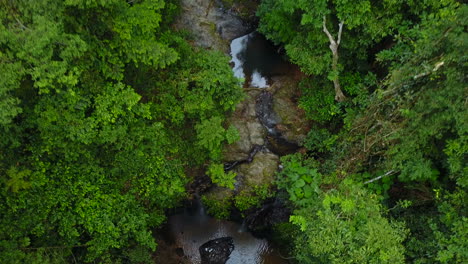 Top-view-of-waterfall-between-trees-in-Koh-Lanta-in-Thailand