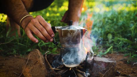 Making-coffee-on-camp-fire-with-moka-pot