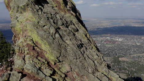 Aerial-footage-of-Flatiron-rocks-with-climber-west-of-Boulder-Colorado