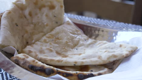 Slowmore-close-up-of-naan-bread-in-an-indian-restaurant