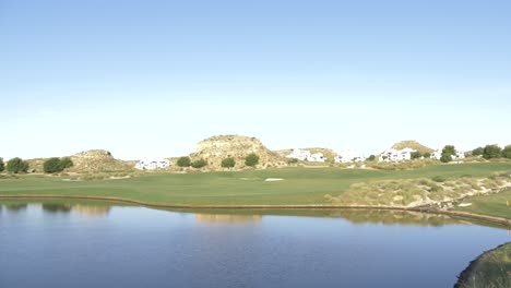golf-course-with-blue-skies-and-big-lake