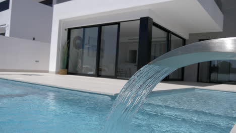 a-luxury-swimming-pool-with-a-water-feature