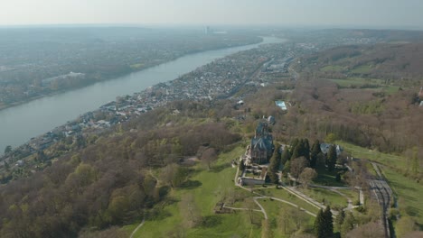 Drone---Aerial-shot-of-the-castle-Drachenburg-and-the-river-rhine-Siebengebirge-near-Bonn---Königswinter-30p