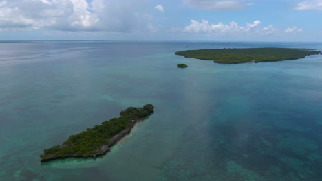 Circling-drone-shot-of-two-lonely-islands-in-Indian-ocean