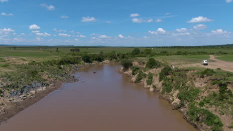 Amazing-drone-shot-during-the-day-in-african-river-and-hippopotamus