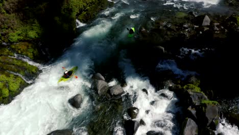 Aerial-view-of-whitewater-kayaker-running-class-IV-rapids-on-the-Mill-Creek-section-of-the-Rogue-River-in-southern-Oregon