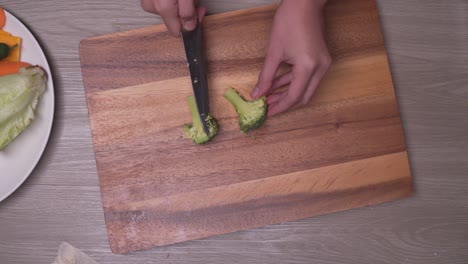 Cooker-sliced-the-broccoli-in-Half-On-A-Cutting-Board---Overhead-Shot