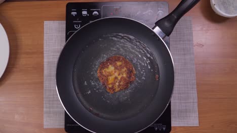 Frying-vegetable-pancakes-on-small-electric-oven,-time-lapse