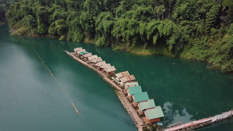 Drone-shot-of-floating-raft-houses-in-Khlong-Phanom-national-park-in-Thailand