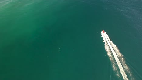 Aerial-drone-following-a-boat-in-the-ocean