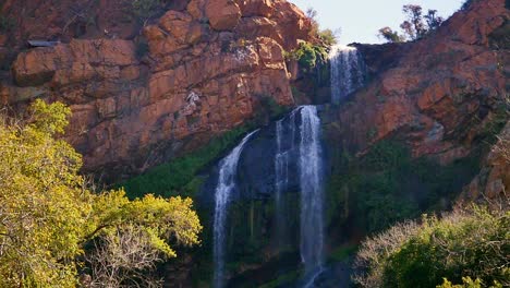 Static-Slow-Motion-Waterfall-flowing-off-Rocky-Mountain-at-the-Walter-Sisulu-National-Botanical-Garden-in-Johannesburg,-South-Africa