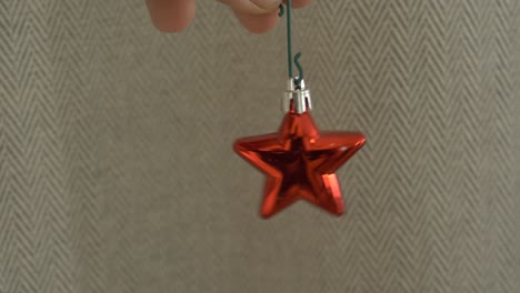 hanging-red-christmas-bauble-shaped-as-a-star