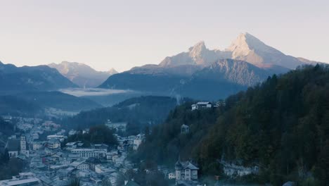 Autumn-Landscape-in-Bavaria,-Germany-|-4K-UHD-D-LOG---Cold,-misty-sunrise-Fall-colours-over-Berchtesgarden-Germany,-featuring-a-cinematic-drone-shot-of-the-town-and-mountains
