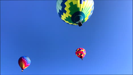 3-hot-air-balloons-overhead,-rotate