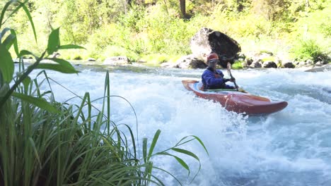 Man-having-fun-while-whitewater-kayaking