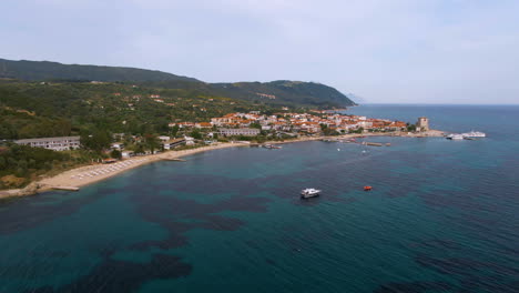 Aerial-footage-of-Ouranoupoli-village-on-the-coastline-in-Athos-in-Halkidiki-during-sunny-day