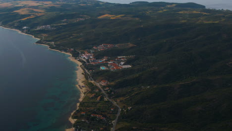 Drone-shot-of-hotel-resort-on-the-coastline-with-swimming-pools-in-Athos-in-Halkidiki