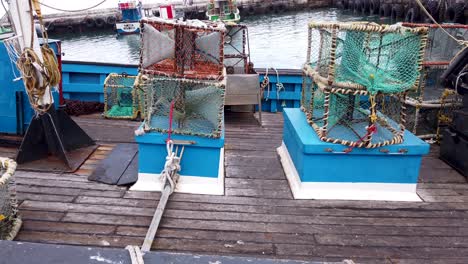 Crab-pots-on-a-boat-in-harbor
