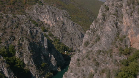 Flying-between-cliffs-in-Matka-canyon-in-Macedonia-on-a-sunny-day