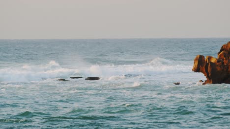 Big-Wave-crush-over-the-rocks-on-the-Indian-ocean,-Durban-Kwazulu-Natal-South-Africa
