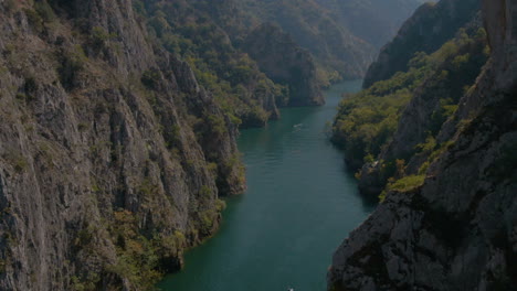 Flying-between-cliffs-in-Matka-canyon-in-Macedonia-on-a-sunny-day